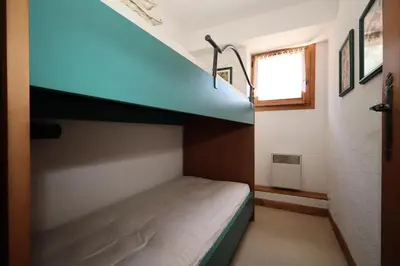 a bunk bed in a small room with a ladder at Résidence Les Eaux Rousses - Les Eaux Rousses MAE-9964 in Les Houches