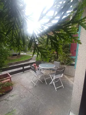 a table and chairs sitting on a patio at L'alpage in Chamonix-Mont-Blanc