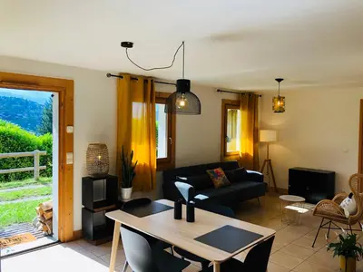a living room with a couch and a table at Chalet Cosy in Saint-Gervais-les-Bains