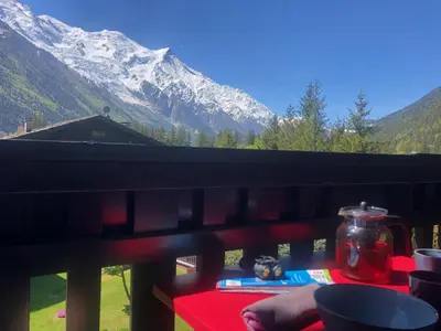 a view of a snow covered mountain from a table at Chamonix - superbe appartement vue Mont Blanc in Chamonix-Mont-Blanc