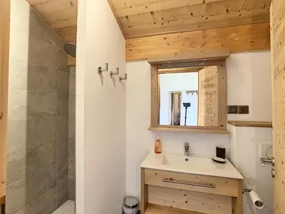 a bathroom with a sink and a shower at Demi-chalet de luxe avec piscine et vue Mont Blanc - FR-1-560-71 in Combloux