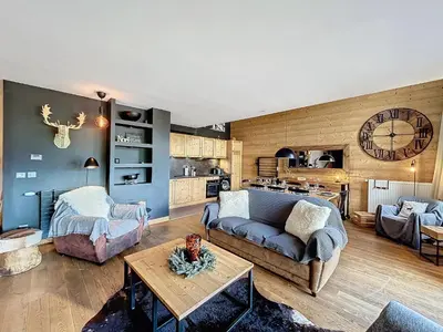 a living room with a couch and a table at Demi-chalet de luxe avec piscine et vue Mont Blanc - FR-1-560-71 in Combloux