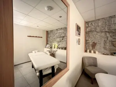 a bathroom with a sink and a mirror at Demi-chalet de luxe avec piscine et vue Mont Blanc - FR-1-560-71 in Combloux