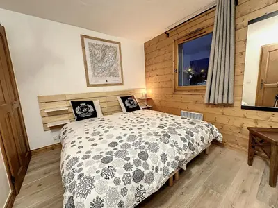 a bedroom with a bed and a window at Grey Squirrel Home in Chamonix-Mont-Blanc