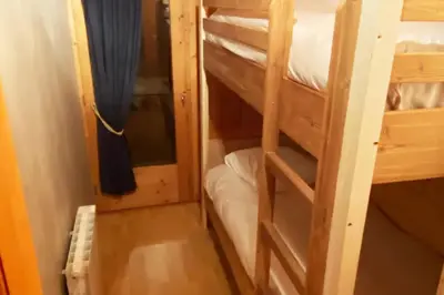 a couple of bunk beds in a room at Le Battieu in Samoëns