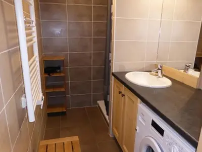 a bathroom with a sink and a washing machine at Duplex Moderne au Centre avec Balcon, 6 Pers. - FR-1-629-13 in Samoëns