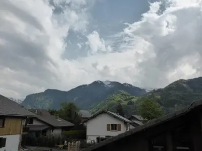 a view of a mountain range with houses and mountains at Duplex Moderne au Centre avec Balcon, 6 Pers. - FR-1-629-13 in Samoëns