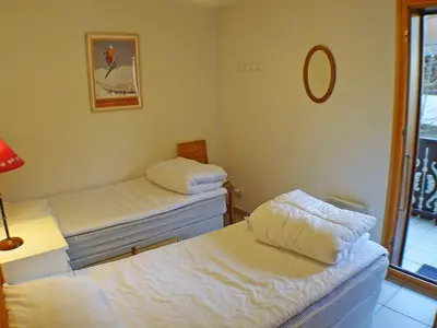 a room with two beds and a mirror at Spacieux appartement 4 pièces avec WIFI, animaux acceptés, parking - FR-1-629-14 in Samoëns