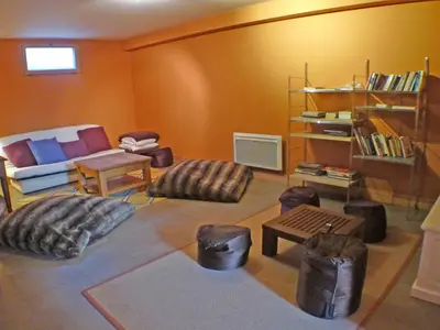 a living room with a couch and chairs and a table at Chalet spacieux 12 pers, animaux admis, parking, Wi-Fi - FR-1-629-1 in Samoëns