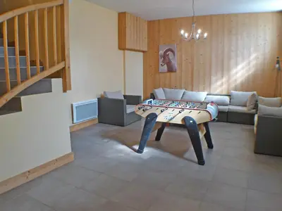 a living room with a table in the middle of it at Chalet spacieux 12 pers, animaux admis, parking, Wi-Fi - FR-1-629-1 in Samoëns
