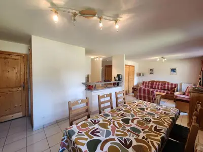a kitchen and a living room with a bed in a room at Grand T3 avec cabine - 6 à 8 pers. - Samoëns - FR-1-629-4 in Samoëns