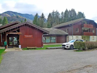 a car parked in a parking lot in front of a building at Appartement de 6 personnes avec terrasse, parking et Wi-Fi - FR-1-629-25 in Samoëns