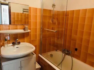 a bathroom with a sink and a shower and a tub at T2 calme à Samoëns, terrasse et parking pour 4-6 pers. - FR-1-629-16 in Samoëns