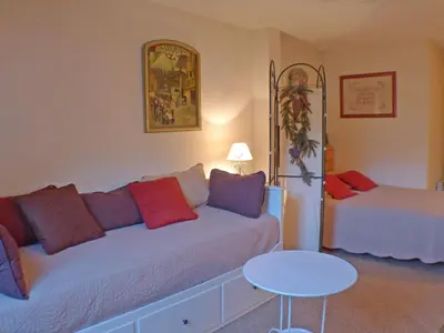 a living room with a couch and a table at Appartement 5 pers. avec balcon privé et parking à Samoëns - FR-1-629-20 in Samoëns