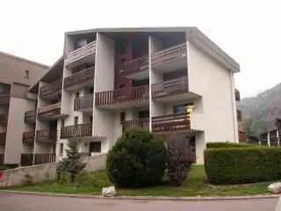 a large building with balconies on the side of it at Appartement lumineux 2 pièces cabine, animaux admis, proche centre Samoëns - FR-1-629-22 in Samoëns