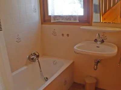 a bathroom with a sink and a tub and a sink and a toilet at Appartement calme à Samoëns, 2 chambres, animaux admis, proche centre - FR-1-629-24 in Samoëns