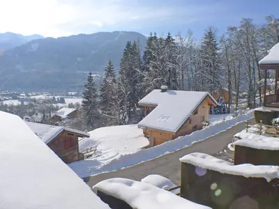 a snow covered roof of a house with snow on it at Appartement calme à Samoëns, 2 chambres, animaux admis, proche centre - FR-1-629-24 in Samoëns