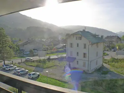 a view from a window of a building with a parking lot at Charmant duplex pour 6 pers. avec TV et parking à Samoëns. - FR-1-629-29 in Samoëns