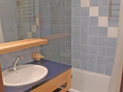 a bathroom with a sink and a shower and a tub at Charmant duplex pour 6 pers. avec TV et parking à Samoëns. - FR-1-629-29 in Samoëns