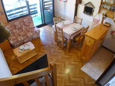 an overhead view of a living room with a table and chairs at Charmant duplex pour 6 pers. avec TV et parking à Samoëns. - FR-1-629-29 in Samoëns