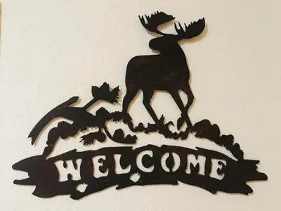 a metal sign with a deer on a welcome sign at Appartement cosy 2-4 pers avec terrasse et parking - FR-1-629-32 in Samoëns