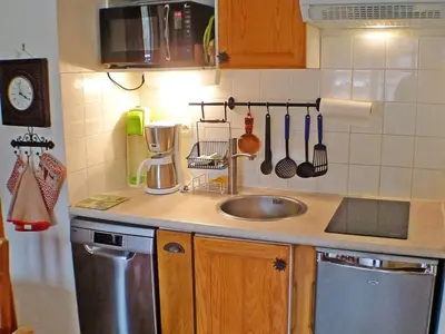 a kitchen with a sink and a counter top at Appartement cosy 2-4 pers avec terrasse et parking - FR-1-629-32 in Samoëns