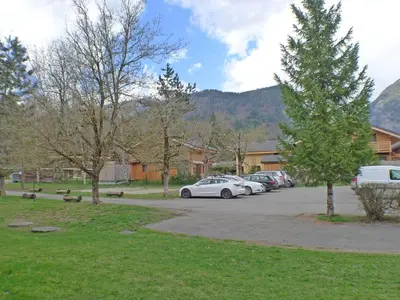 a group of cars parked in a parking lot at Appartement cosy 2-4 pers avec terrasse et parking - FR-1-629-32 in Samoëns