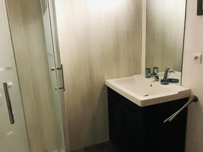 a bathroom with a sink and a shower at Appartement cosy 2-4 pers avec terrasse et parking - FR-1-629-32 in Samoëns