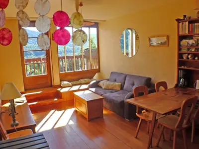 a living room with a couch and a table at Appartement 3 pièces avec balcon et parking à Samoëns - FR-1-629-52 in Samoëns