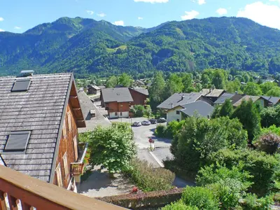 an aerial view of a village with mountains in the background at Appartement 3 pièces avec balcon et parking à Samoëns - FR-1-629-52 in Samoëns