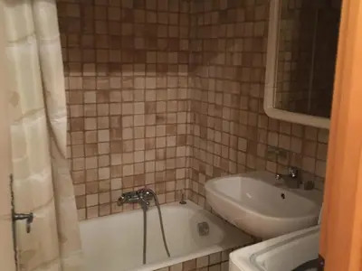 a bathroom with a tub and a sink at Appartement 3 pièces avec balcon et parking à Samoëns - FR-1-629-52 in Samoëns