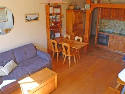 a living room with a couch and a table at Appartement 3 pièces avec balcon et parking à Samoëns - FR-1-629-52 in Samoëns