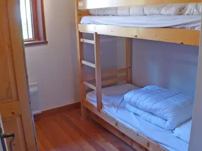 a bunk bed with two pillows on the bottom bunk at Appartement 3 pièces avec balcon et parking à Samoëns - FR-1-629-52 in Samoëns