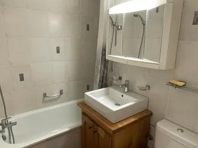 a bathroom with a sink and a tub and a mirror at Appartement 3 pièces à Samoëns, 6 pers., WIFI, Parking - FR-1-629-76 in Samoëns
