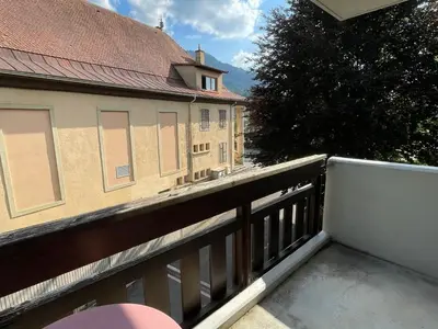 a balcony with a fence and a building at Appartement 3 pièces à Samoëns, 6 pers., WIFI, Parking - FR-1-629-76 in Samoëns