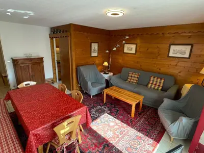 a living room with a couch and a table at Appartement 3 pièces à Samoëns, 6 pers., WIFI, Parking - FR-1-629-76 in Samoëns