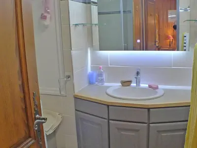 a bathroom with a sink and a mirror at Charmant T3 calme à 500m du centre de Samoëns avec parking - FR-1-629-57 in Samoëns