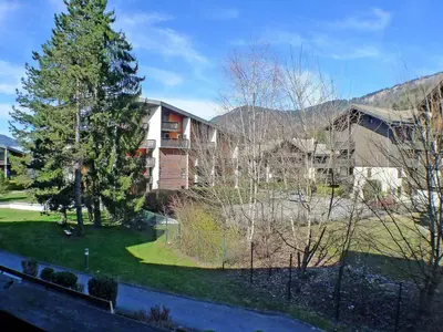 a view of a apartment complex with a tree at Studio cosy au centre de Samoëns, 4 pers, proche commodités - FR-1-629-65 in Samoëns