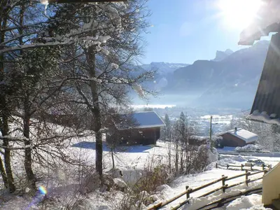 a snow covered hillside with a house and trees at Studio calme pour 4 pers. avec terrasse à Samoëns - FR-1-629-30 in Samoëns