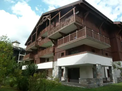 an apartment building with balconies on the side of it at Appartement T3 cosy avec balcon au centre de Samoëns - FR-1-624-31 in Samoëns