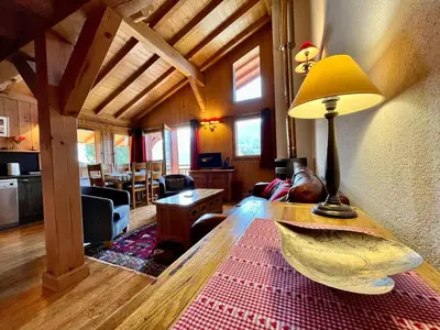 a living room with a table with a lamp on it at Appartement moderne 3 chambres avec balcon à Samoëns - FR-1-624-25 in Samoëns
