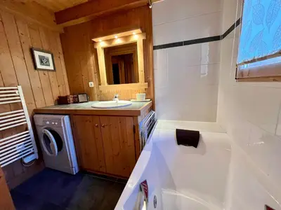 a bathroom with a sink and a washing machine at Appartement moderne 3 chambres avec balcon à Samoëns - FR-1-624-25 in Samoëns