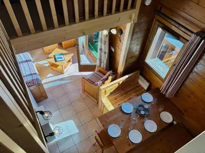 an overhead view of a dining table in a cabin at Appartement en duplex avec piscine à Samoëns - FR-1-624-12 in Samoëns