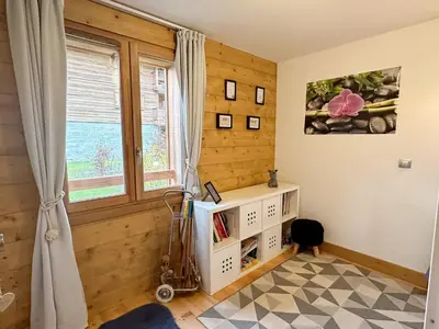 a childs room with a window and a book shelf at Charmant T3 au cœur de Samoëns avec jardin, parking et proche ski-bus - FR-1-624-16 in Samoëns