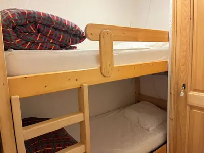 a couple of bunk beds in a room at Appartement T2 au cœur du village avec parking - FR-1-624-20 in Samoëns