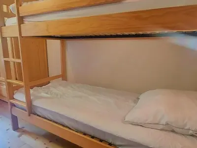 a wooden balcony with a view of a mountain at Duplex chaleureux près télécabine, balcon & WIFI - FR-1-624-33 in Samoëns