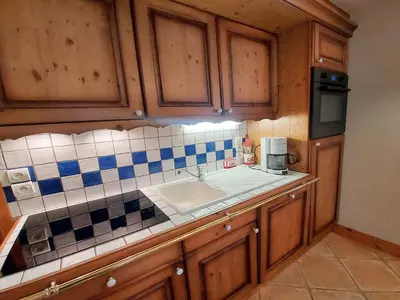a kitchen with a sink and a counter top at Appartement T3 au cœur de Samoëns avec terrasse et garage - FR-1-624-28 in Samoëns