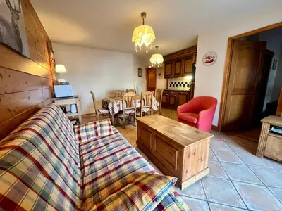 a living room with a couch and a table at Appartement T3 au cœur de Samoëns avec terrasse et garage - FR-1-624-28 in Samoëns