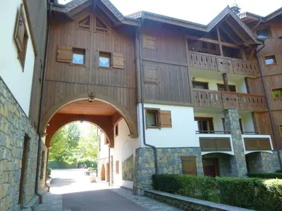 an external view of a building with an archway at Appartement T3 au cœur de Samoëns avec terrasse et garage - FR-1-624-28 in Samoëns