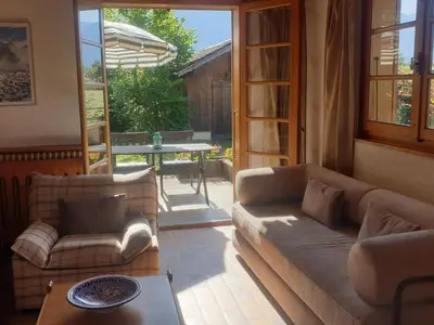 a living room with a couch and a table at Appartement chalet calme, proche centre, animaux acceptés - FR-1-624-45 in Samoëns